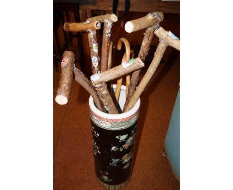 Chinese stick holder with various walking sticks 