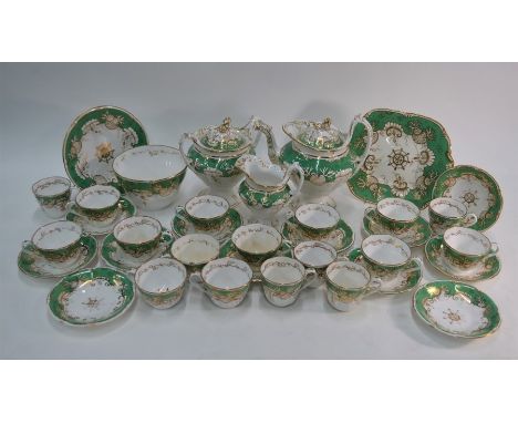 A Victorian rococo style tea and coffee service, possibly Rockingham, pattern 1027, decorated with a green band and gilded se