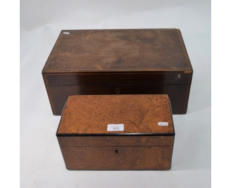 An ebony banded burr walnut tea caddy, the interior with twin dome top boxes flanking a circular well containing an associate