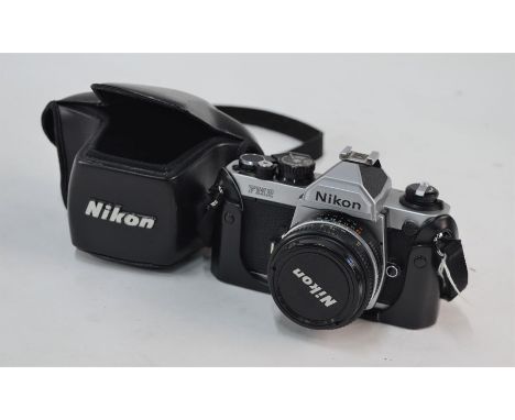 A Nikon FM2 SLR camera with leather cover