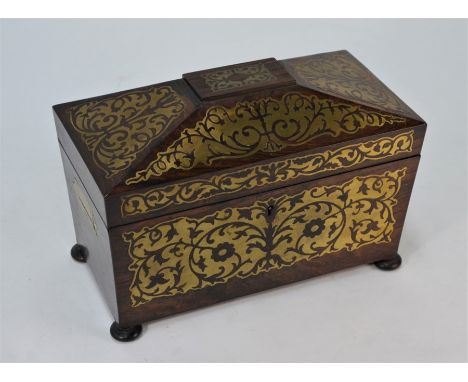 A Regency brass inlaid rosewood tea caddy with flush folding handles, the interior with two boxes flanking a glass bowl, on b