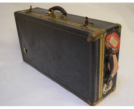 A Dover Luggage Inc., Madison Avenue, New York cabin trunk with Cunard and White Star labels and an ox-blood leather fitted v