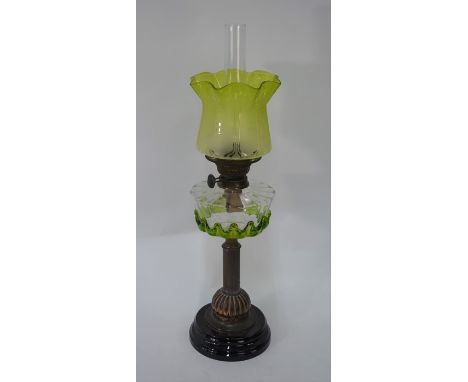 An Edwardian oil lamp with Art Nouveau etched radium glass shade, two-colour glass font on reeded brass pillar and glazed cer