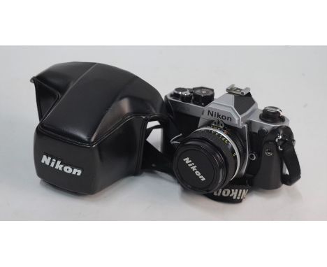 A Nikon FM2 SLR camera with leather cover