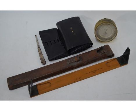 An aneroid barometer with silvered dial in gilt brass drum case, 9.5 cm to/w a part set of 19th century field surgeon's instr
