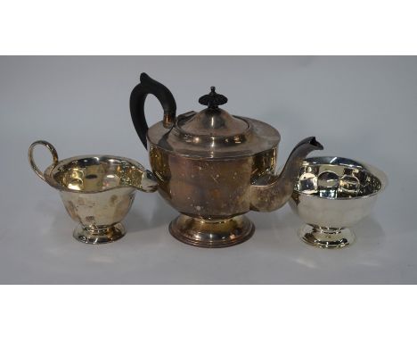 A silver three piece tea service of circular form on stemmed foot, Viners, Sheffield 1930, 21.8oz gross