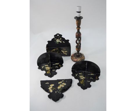 A floral-painted papier-mache wall-pocket, to/w three matching folding wall-brackets and an Indian floral-painted lamp-base (