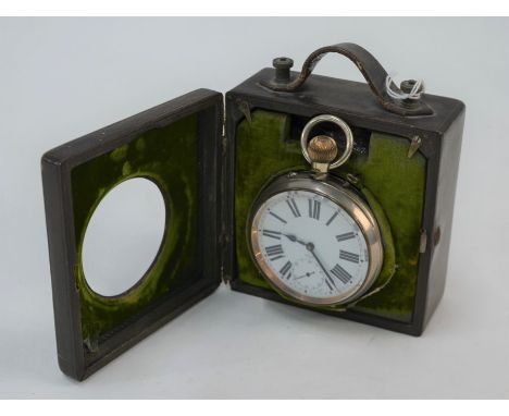 An Edwardian unusual 'Night and Day' electroplated Goliath watch in fitted leather case with battery pack to illuminate the l