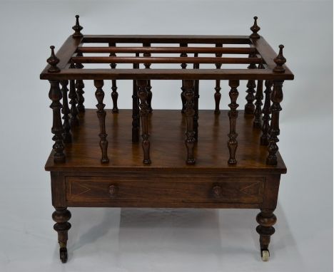 A Victorian walnut Canterbury with three divisions over a drawer, raised on turned feet to ceramic castors, 54 cm w x 39 cm x