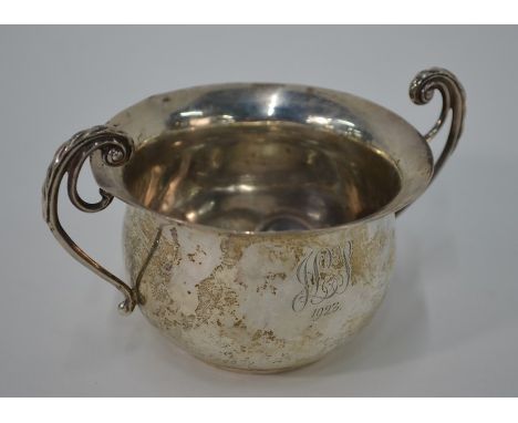 A silver sugar basin with twin scroll handles, Josiah Williams &amp; Co, London 1922, 4oz,&nbsp; to/w a cased epns three-piec