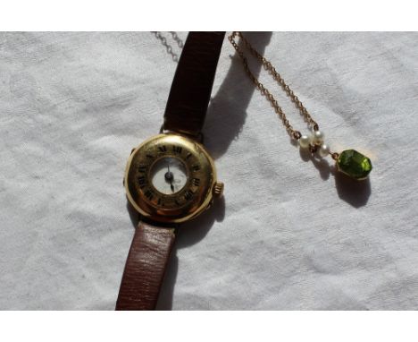 An Lady's 18ct yellow gold Rolex half hunter wristwatch, the enamel dial with Arabic numerals on a leather strap together wit