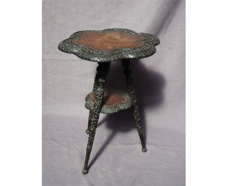 A 19th century walnut tripod table, the six sided shaped top carved with shamrocks and leaves, the turned and carved legs sim