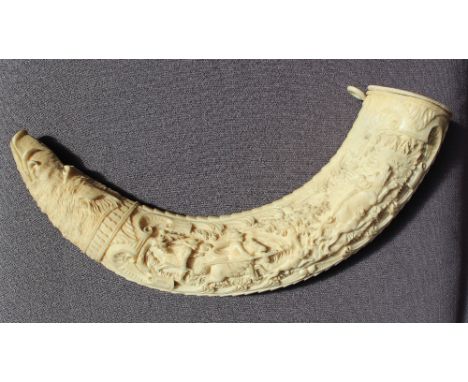 A 19th century carved ivory boar tusk powder flask, ornately intaglio carved ivory wild boar tusk, one side with highly detai