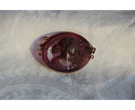 An amethyst coloured glass cameo panel brooch depicting a maiden in profile together with bar brooches and stick pins