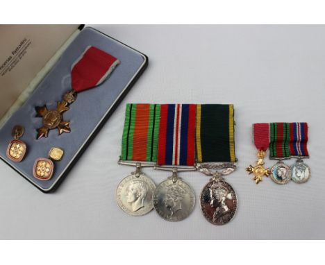 A set of three World War II medals including the Defence medal, the War medal and the Territorial army medal, issued to 20733