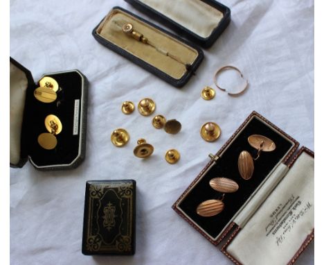 A pair of 9ct yellow gold cufflinks together with assorted 9ct gold shirt studs, approximately 11 grams together with a stick