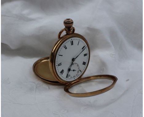 A 9ct yellow gold open faced pocket watch, the enamel dial with Roman numerals and a seconds subsidiary dial