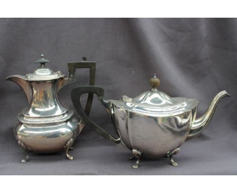 A George V silver hot water pot, Sheffield, 1927, Walker & Hall together with an Elizabeth II silver teapot, Birmingham, 1966