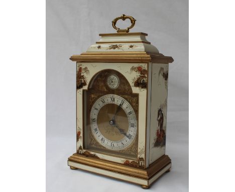 A 20th century Elliott of London chinoiserie decorated white lacquered mantel timepiece with swing loop handle above square d