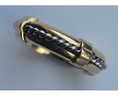 ASPREYS &amp; CO: A good 18 carat two colour gold ring with spinning mechanism. Approx. 14 grams. Est. £300 - £400.