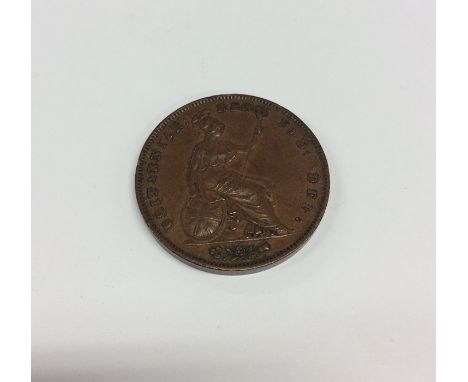 A rare Victorian 1853 copper coin with seated Britannia grasping trident. Est. £200 - £300.