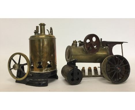 A brass mounted steam engine complete with burner together with one other. Est. £20 - £30.