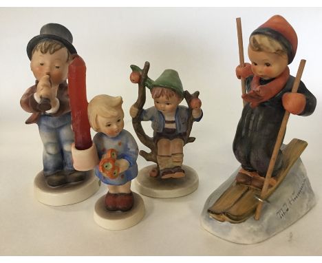 A group of four Hummel figures of children. Est. £20 - £30.