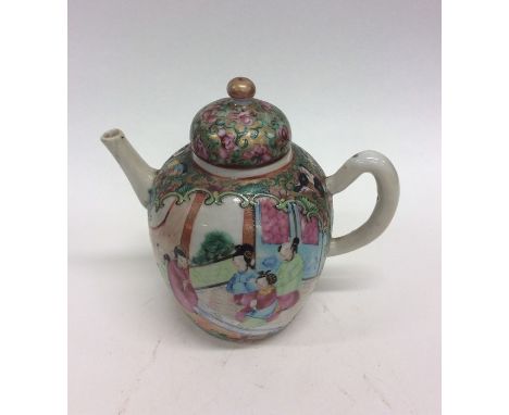 A small baluster shaped Canton teapot decorated with bright colours. Approx. 12 cms high. Est. £25 - £35.