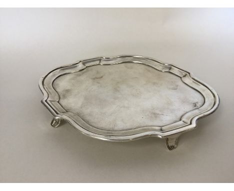 A Georgian oval silver teapot stand with wavy edge. London. By HC. Approx. 134 grams. Est. £100 - £150.
