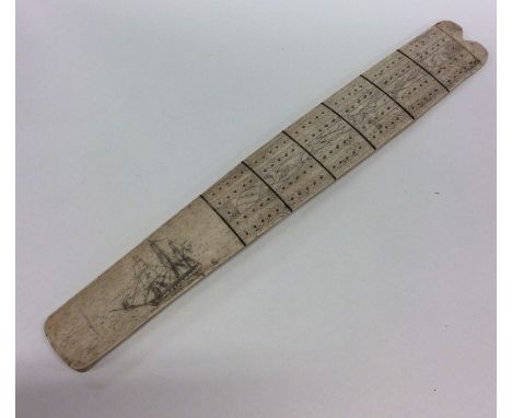 An unusual whalebone cribbage board etched with a sailing boat. Est. £20 - £30.