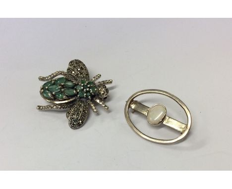 A silver and opal bar brooch together with a marcasite bug brooch. Est. £20 - £30.