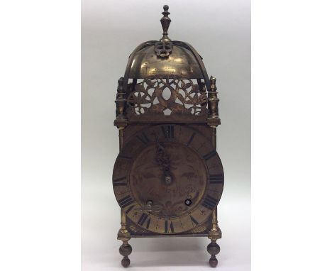 A large brass lantern clock of typical design with striking movement. By Thomas Mudge. Est. £300 - £400.