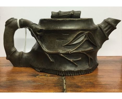 An unusual small simulated bamboo pottery teapot. Est. £30 - £40.