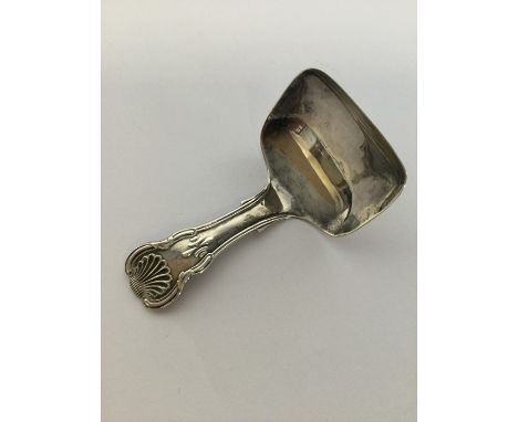 A small kings' pattern silver caddy scoop. Birmingham. By JT. Approx. 12 grams. Est. £40 - £60.