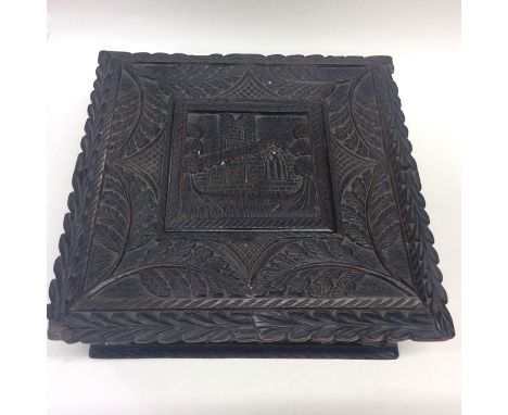 Bog Oak: A good square jewellery caddy of typical design carved with clovers and hinge top. Approx. 23 cms square. Est. £100 