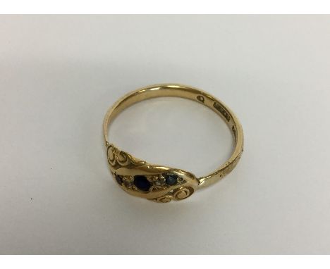 A 9 carat sapphire and diamond ring. Approx. 3 grams. Est. £35 - £45.