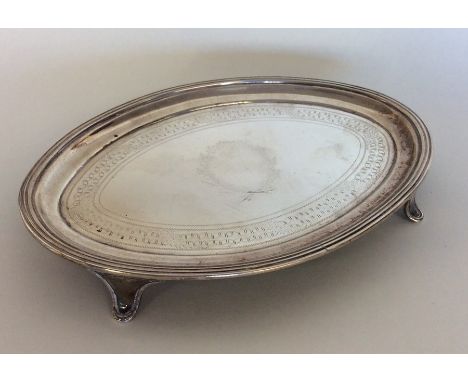 A good Georgian silver oval teapot stand. London. By JE. Est. £150 - £200.