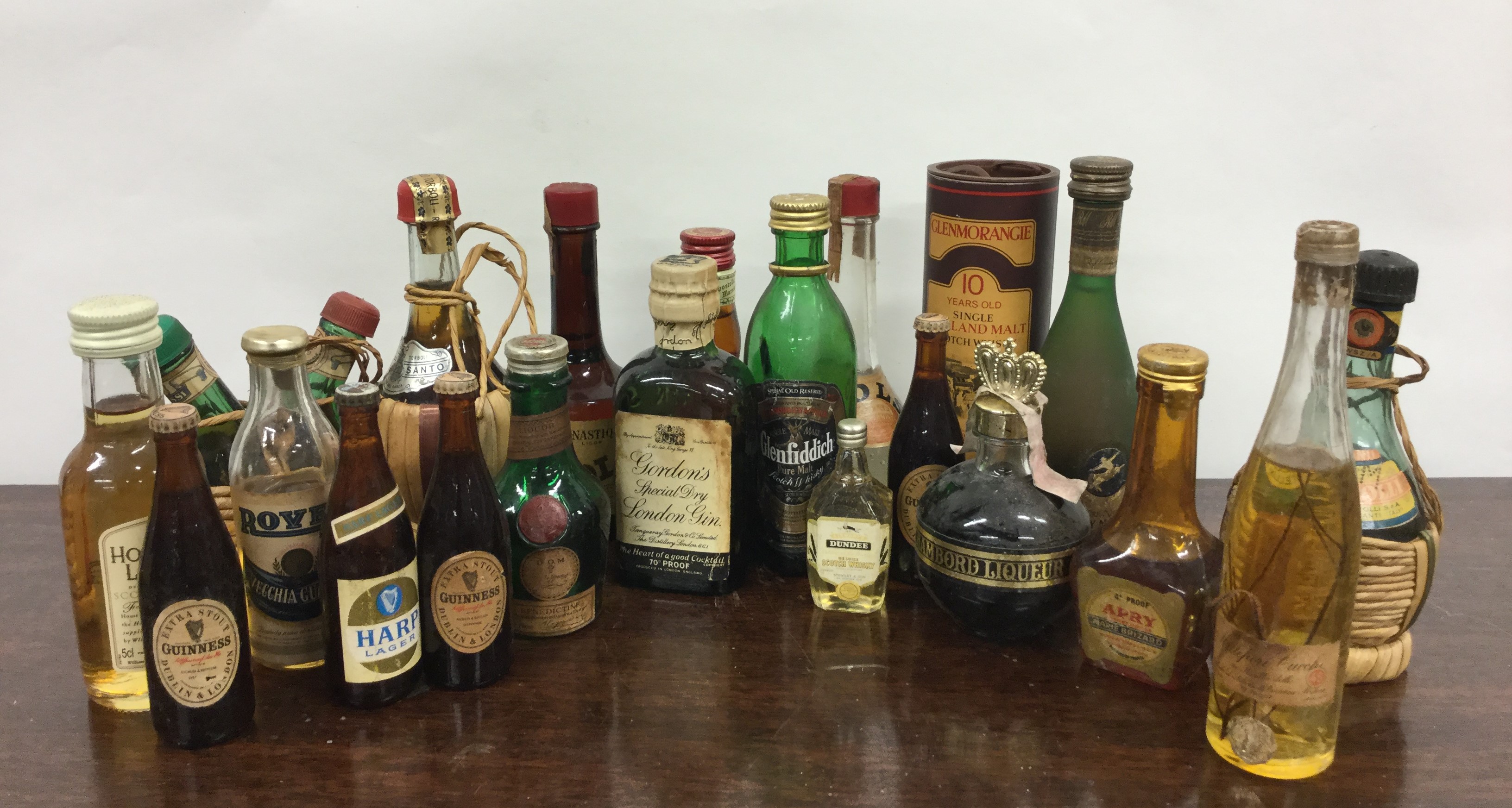 A selection of various miniature bottles of wines and spirits, to