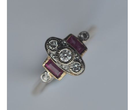 A ruby and diamond oval cluster ring in 9 carat setting. Approx. 4 grams. Est. £60 - £80.