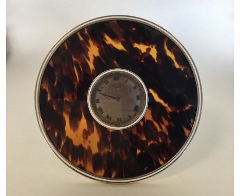 A good tortoiseshell, enamel and silver gilt Art Deco clock with pierced stand. London. By TC. Approx. 14.5 cms. Approx. 338 