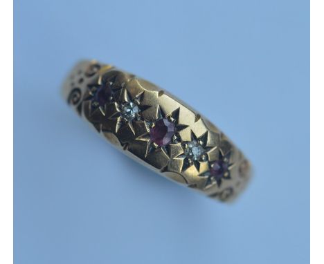 A ruby and diamond gypsy set ring in 18 carat mount. Approx. 4 grams. Est. £50 - £80.