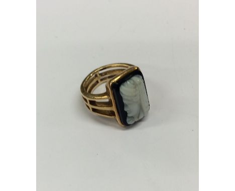 A good Antique hard stone cameo ring with openwork band to rectangular top. Approx. 8 grams. Est. £350 - £450.