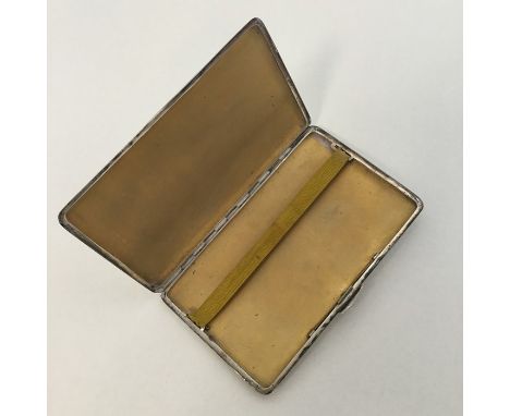 A heavy silver engine turned cigarette case with gilt interior. Birmingham. By JR. Approx. 198 grams. Est. £40 - £60.