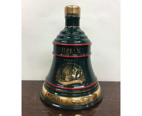 1 x 70cl bottle of Bell's Old Scotch Whisky in green Wade bell shaped decanter entitled, "Christmas 1992". (1)