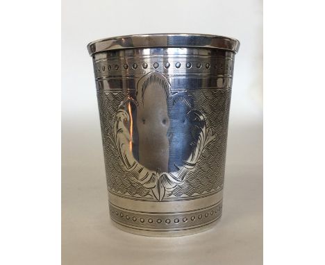 A Continental silver goblet in the form of a thimble with engine turned decoration. Approx. 68 grams. Est. £50 - £80.