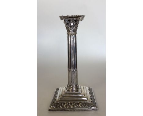 A good Georgian silver cast taper stick in the form of a Corinthian column. London 1766. Approx. 16cms high. Approx. 161 gram