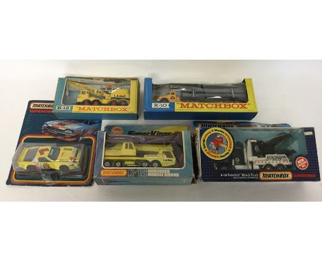 MATCHBOX: Five various boxed / packaged die-cast model trucks to include two different K-12 Laing Cranes; a K-10 pipe truck; 