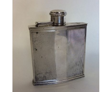 A good silver engine turned hip flask with hinged top. Birmingham. Approx. 143 grams. Est. £130 - £150.