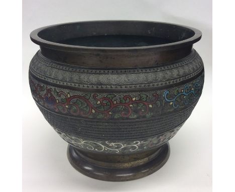 A brass cloisonné jardiniere decorated with enamel. Approx. 19 cms high. Est. £40 - £60.
