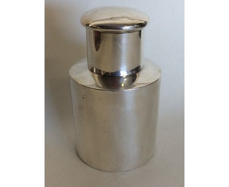 A small cylindrical silver tea caddy with lift-off cover. Chester. By EJH. Approx. 71 grams. Est. £60 - £80.